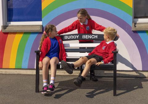 Students on a bench in Forest's playground